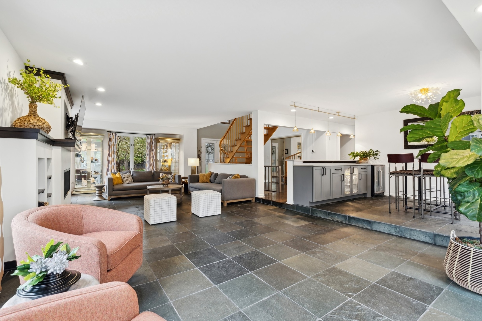 3606 Lawson Road Glenview, IL 60026 - Photo 23 of 62 a living room with furniture a fireplace and a potted plant