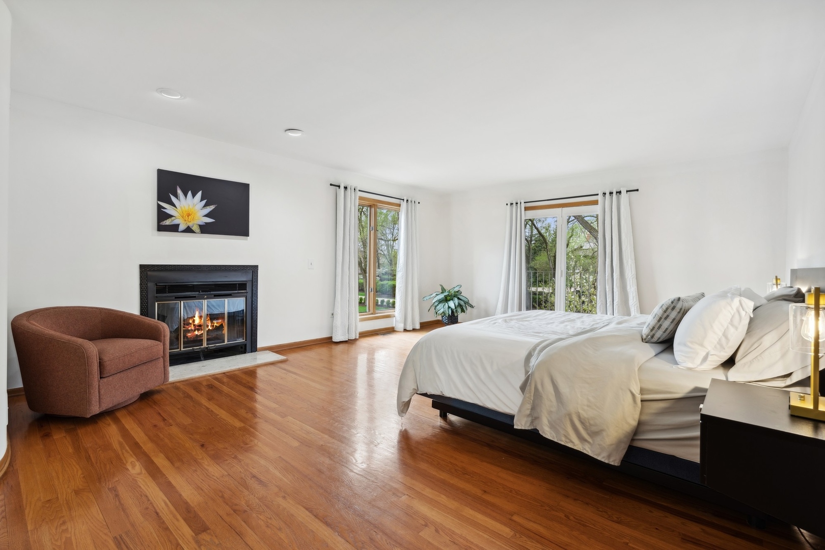 3606 Lawson Road Glenview, IL 60026 - Photo 25 of 62 a bedroom with a bed and a fireplace