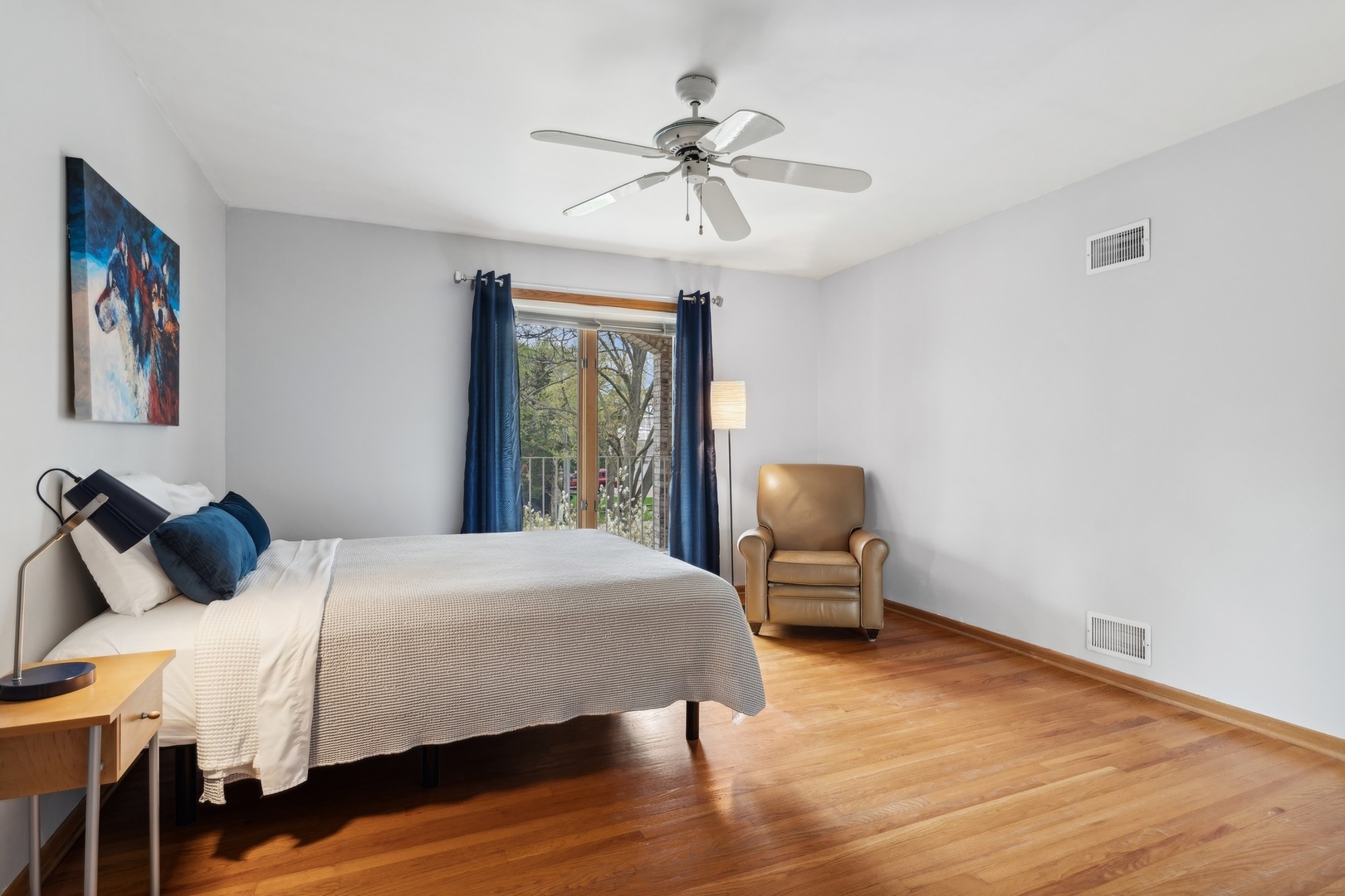 3606 Lawson Road Glenview, IL 60026 - Photo 31 of 62 a bedroom with a bed and a chair