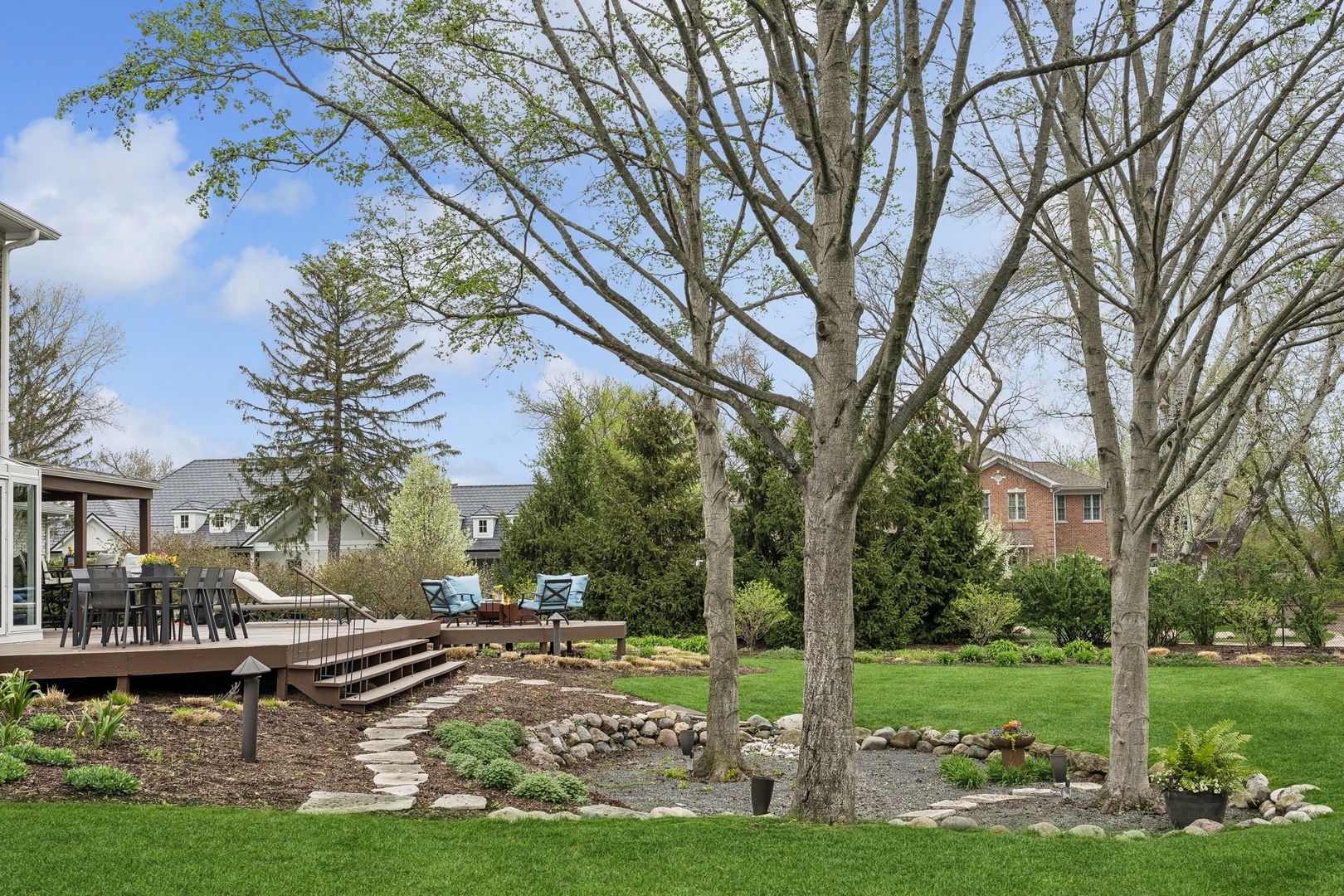 3606 Lawson Road Glenview, IL 60026 - Photo 54 of 62 a front view of a house with garden and trees