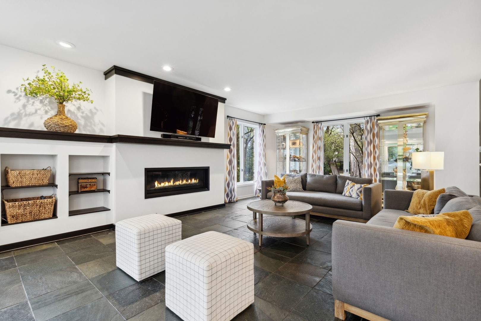 3606 Lawson Road Glenview, IL 60026 - Photo 6 of 62 a living room with furniture fireplace and flat screen tv