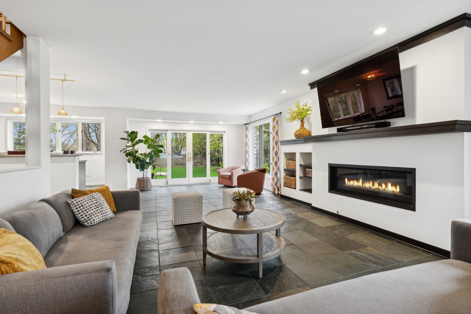 3606 Lawson Road Glenview, IL 60026 - Photo 8 of 62 a living room with furniture a fireplace and a flat screen tv