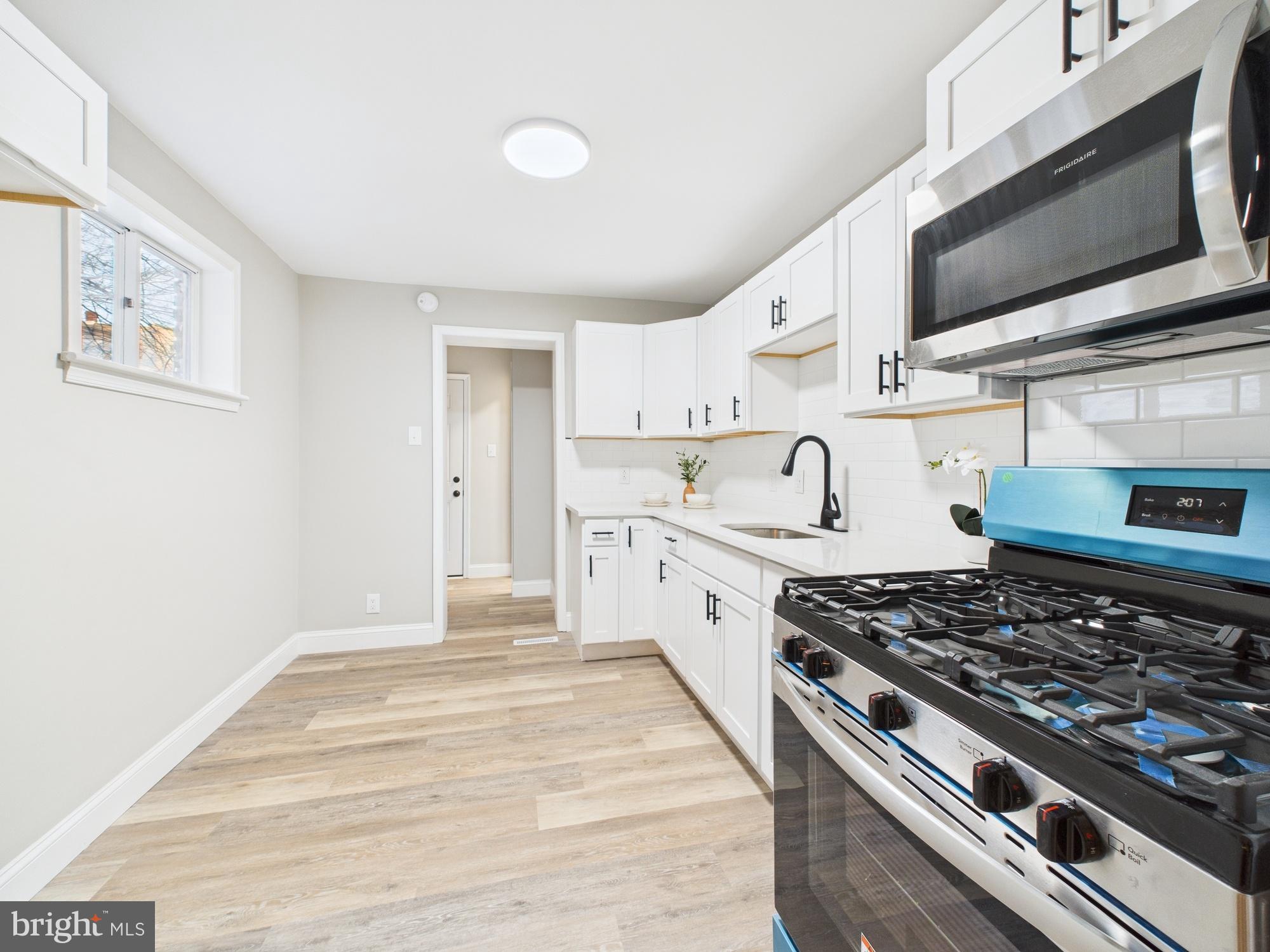 11 Denham Avenue Claymont, DE 19703 - Photo 9 of 28 Bright and modern kitchen with sleek finishes.