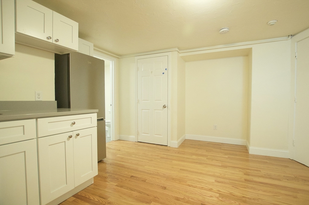 501 East Broadway, Unit 2 Boston, MA 02127 - Photo 2 of 8 a view of cabinets with wooden floor