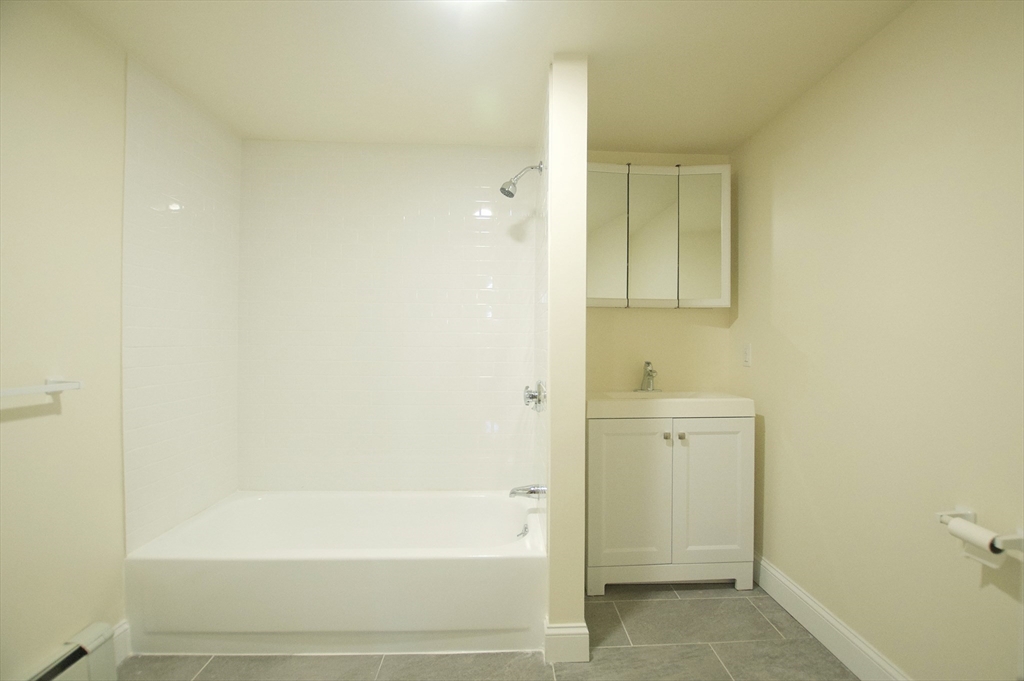 501 East Broadway, Unit 2 Boston, MA 02127 - Photo 4 of 8 a bathroom with a bathtub