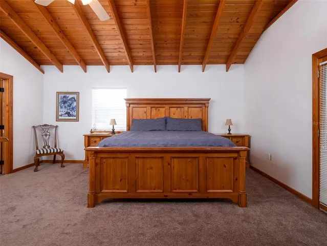 a bathroom with a granite countertop sink toilet and a mirror