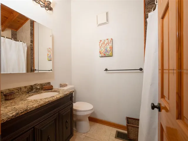 a swimming pool view with a outdoor seating