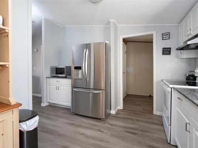 a spacious bathroom with a double vanity sink and a mirror
