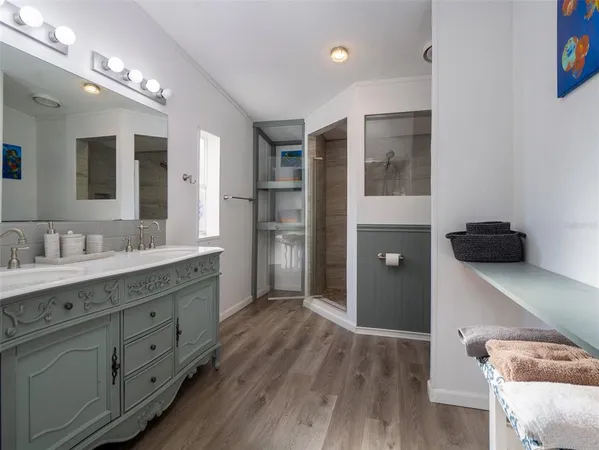 a white toilet sitting next to a bath tub
