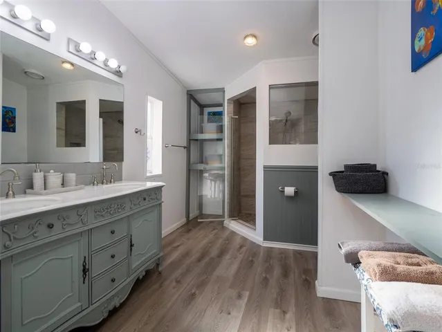 a white toilet sitting next to a bath tub