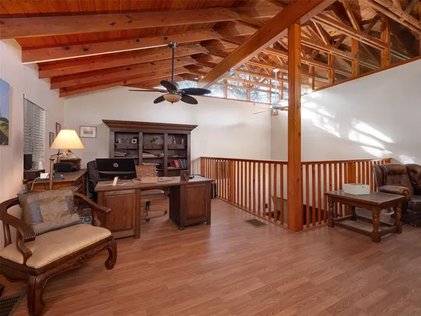 a bed sitting in a room next to a window