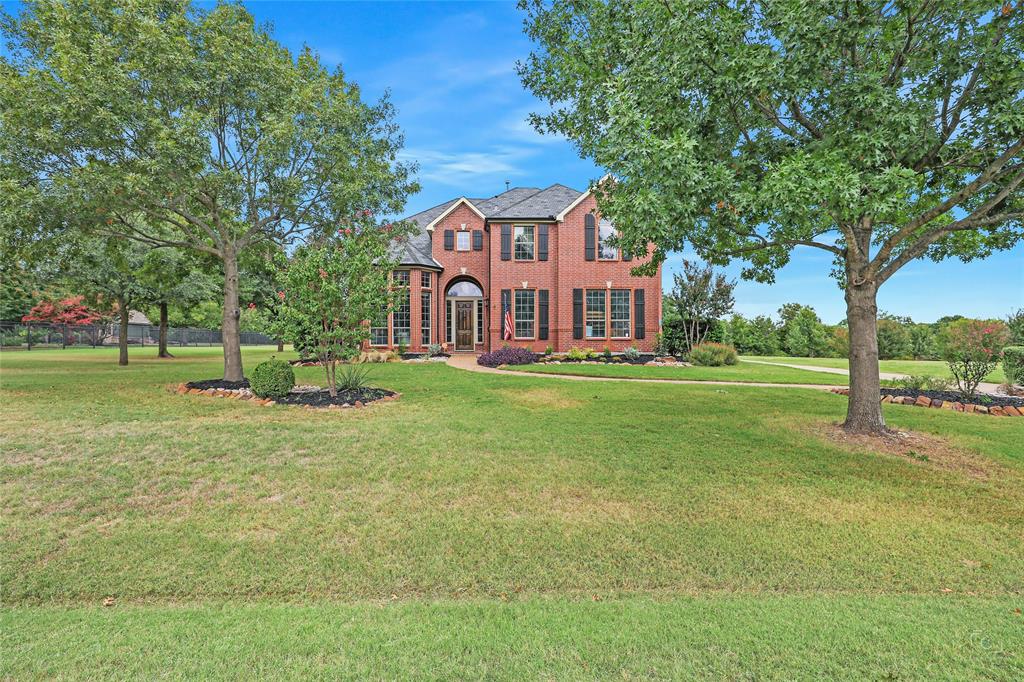 671 Countryside Drive Fairview, TX 75069 - Photo 1 of 36 a front view of a house with a yard