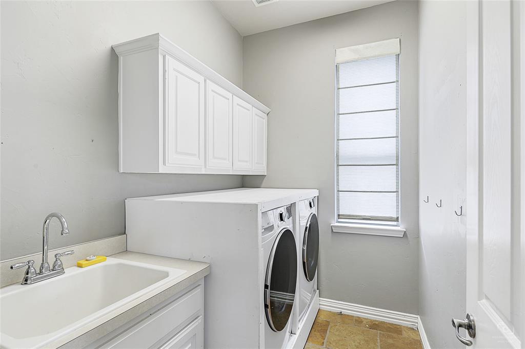 671 Countryside Drive Fairview, TX 75069 - Photo 20 of 36 a utility room with dryer and washer