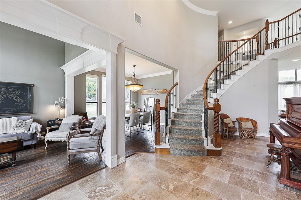 671 Countryside Drive Fairview, TX 75069 - Photo 2 of 36 a living room with furniture and stairs