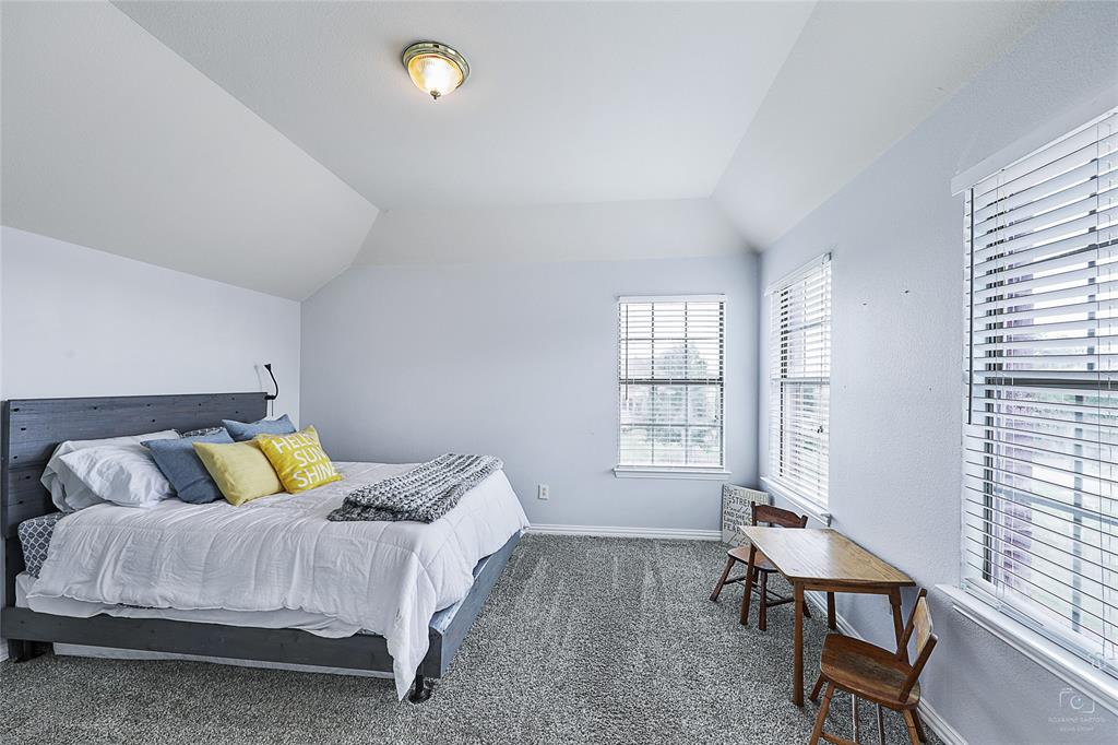 671 Countryside Drive Fairview, TX 75069 - Photo 26 of 36 a bedroom with a bed and table