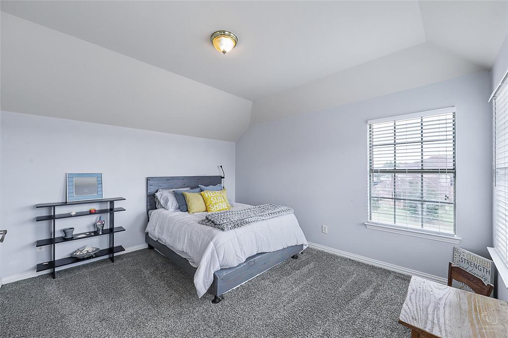 671 Countryside Drive Fairview, TX 75069 - Photo 27 of 36 a bed room with a bed and a window