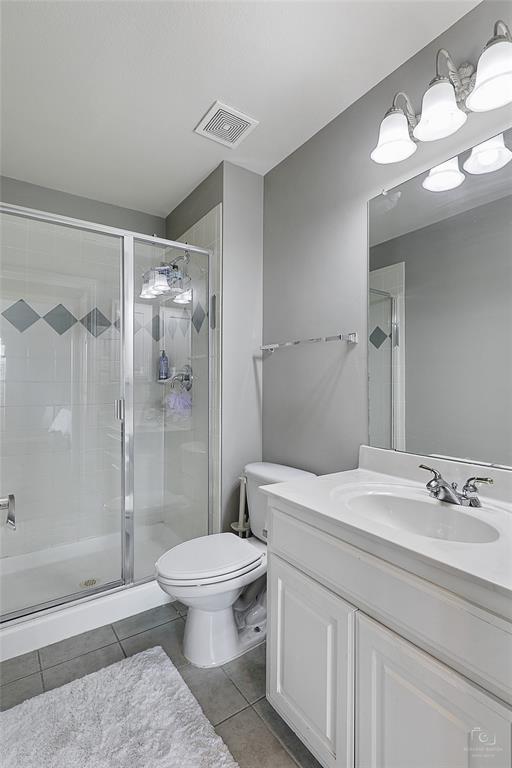 671 Countryside Drive Fairview, TX 75069 - Photo 28 of 36 a bathroom with a sink a toilet and shower