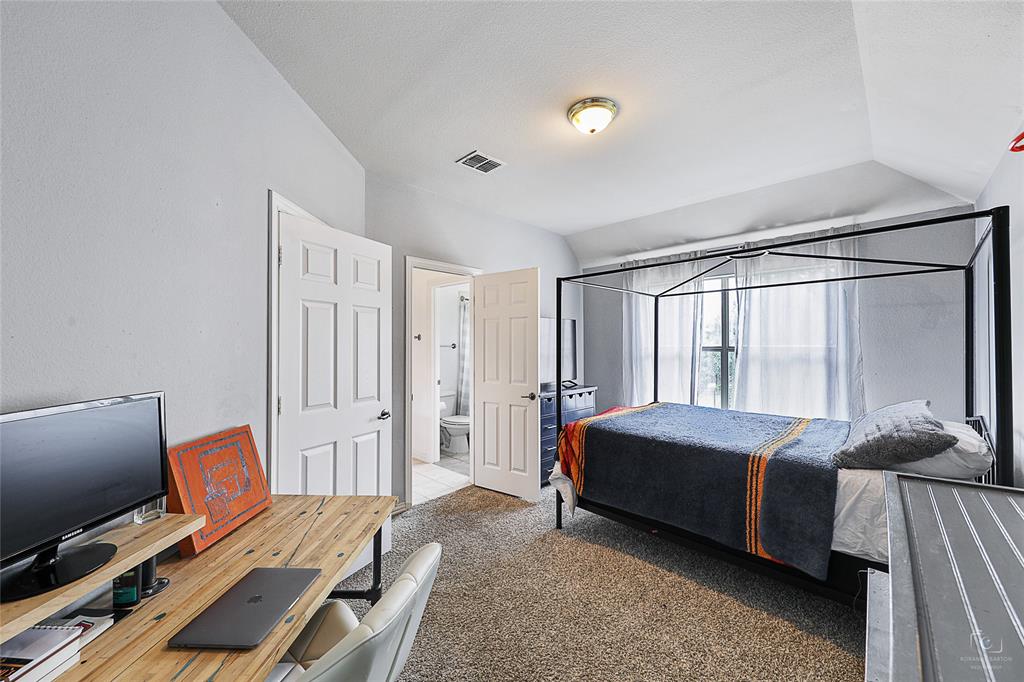 671 Countryside Drive Fairview, TX 75069 - Photo 29 of 36 a bedroom with a bed and large window