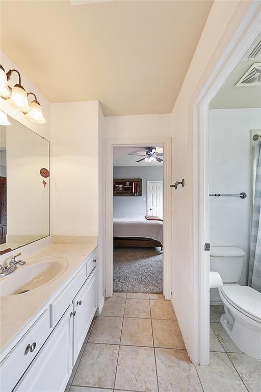671 Countryside Drive Fairview, TX 75069 - Photo 31 of 36 a bathroom with a sink a toilet and shower