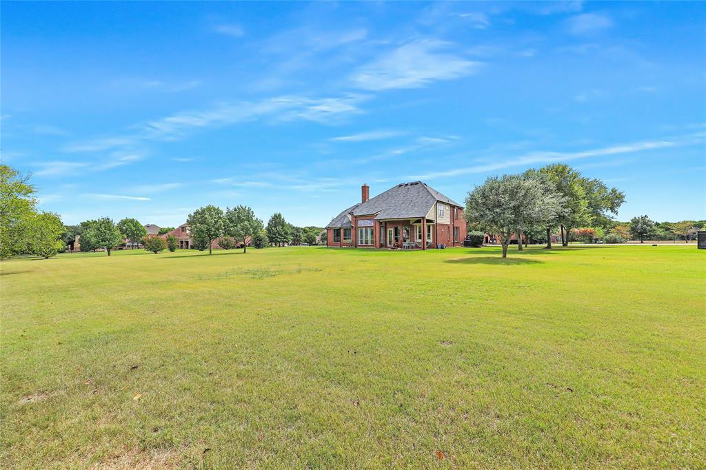 671 Countryside Drive Fairview, TX 75069 - Photo 34 of 36 a view of an ocean and beach