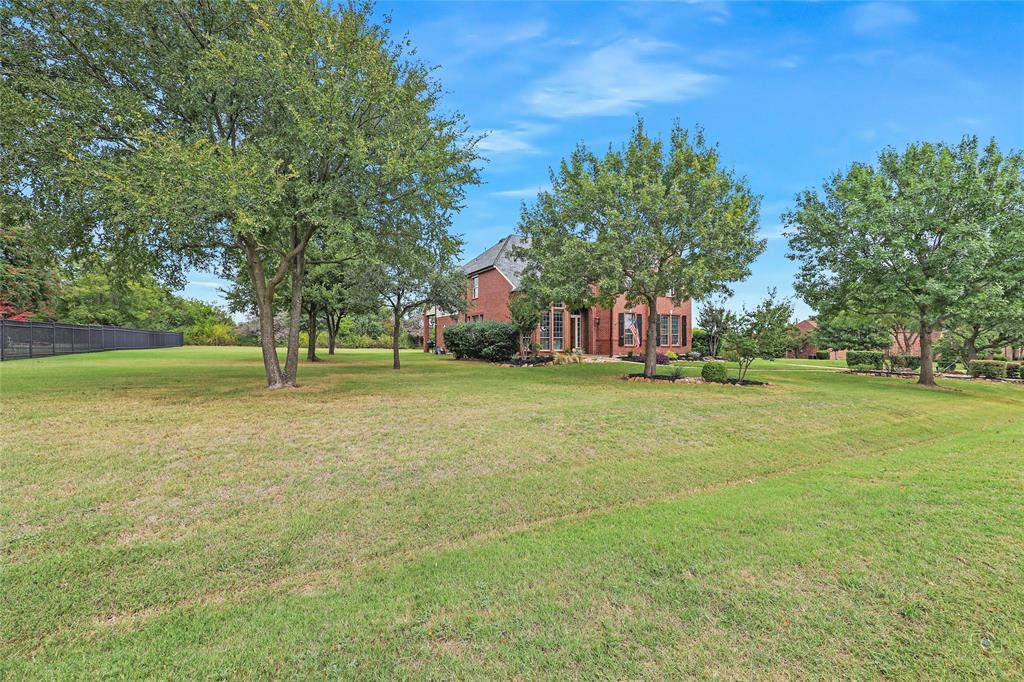 671 Countryside Drive Fairview, TX 75069 - Photo 35 of 36 a view of field with trees