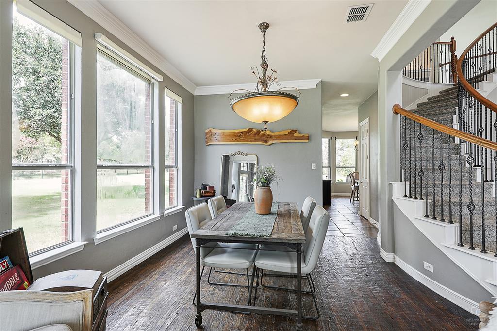 671 Countryside Drive Fairview, TX 75069 - Photo 5 of 36 a view of a dining room with furniture window and wooden floor