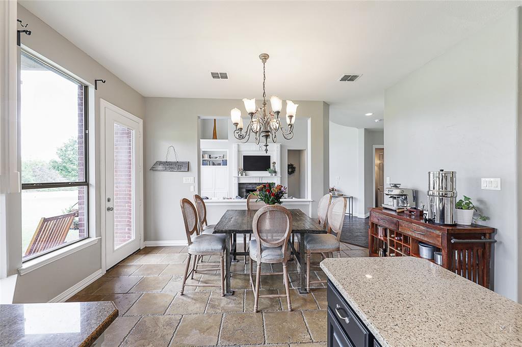 671 Countryside Drive Fairview, TX 75069 - Photo 9 of 36 a view of a dining room with furniture window and outside view