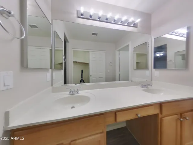 a view of an empty room with a ceiling fan
