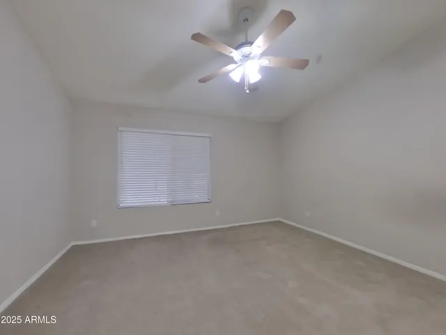 a kitchen with a refrigerator and a stove top oven