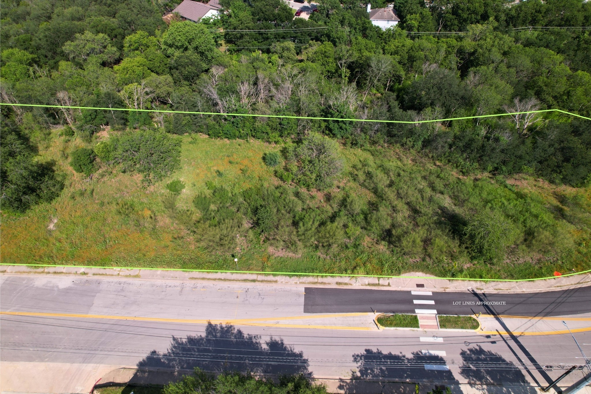 2813-2827 Metcalfe Road Austin, TX 78741 - Photo 8 of 13 A spacious, undeveloped 8 lots with ample greenery borders a quiet street.
