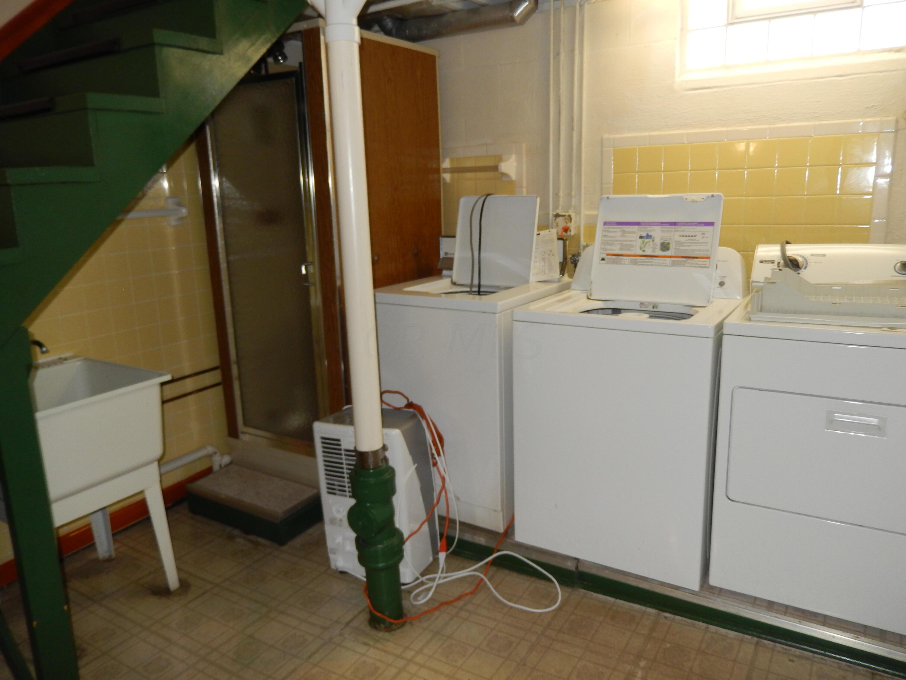 5321 Karl Road Columbus, OH 43229 - Photo 33 of 42 Utility area with 2 washers & 1 dryer, utility sink and shower