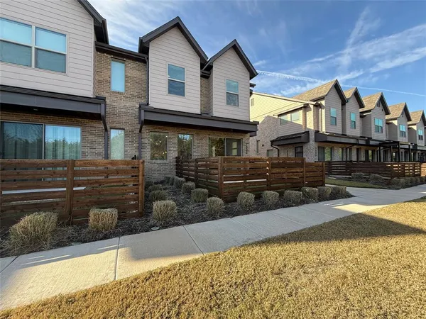 a front view of a house with yard
