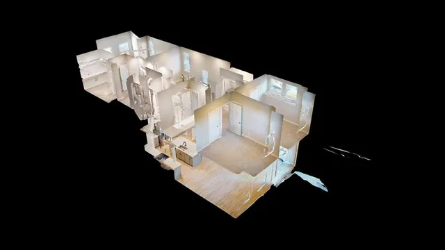 a white vase with flowers sitting on a table