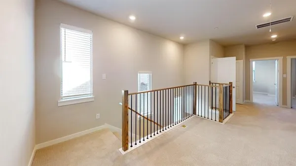 a view of a hallway with windows