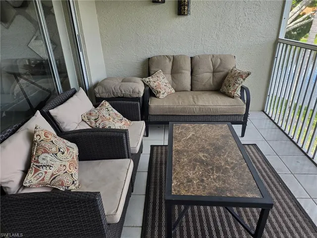a living room with furniture and a couch