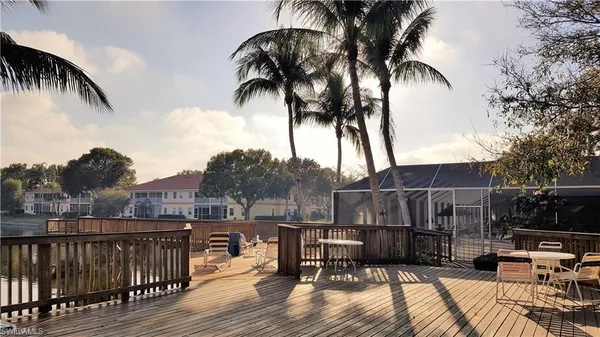 a view of a backyard with table and chairs
