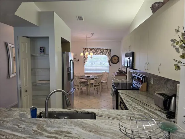 a view of a living room and dining room