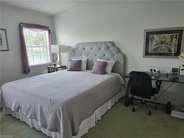 a bed room with a bed furniture and a window