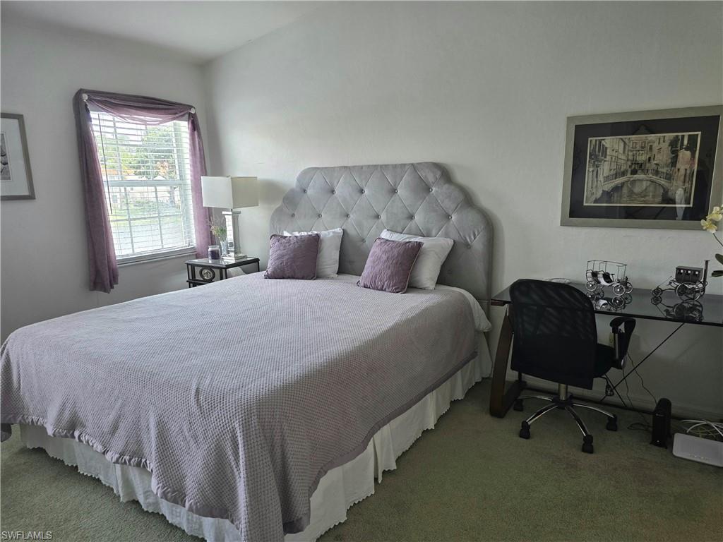 7436 Plumbago Bridge Road, Unit N202 Naples, FL 34109 - Photo 7 of 24 a bed room with a bed furniture and a window