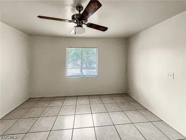 a view of an empty room with a window