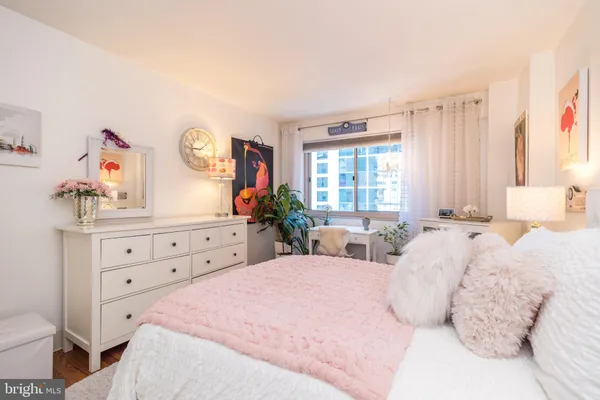 a bed room with bed and a window