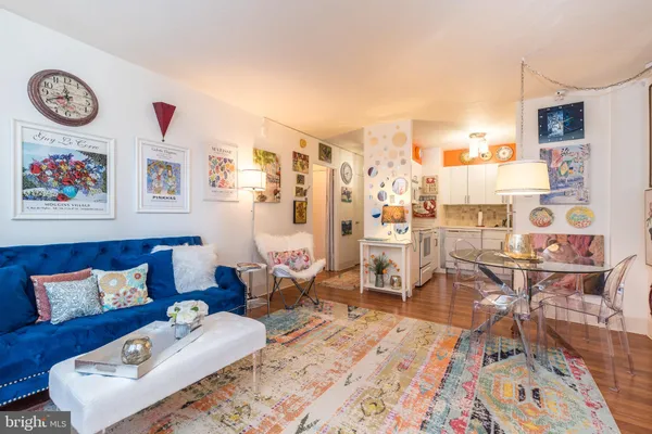 a living room with furniture and a rug