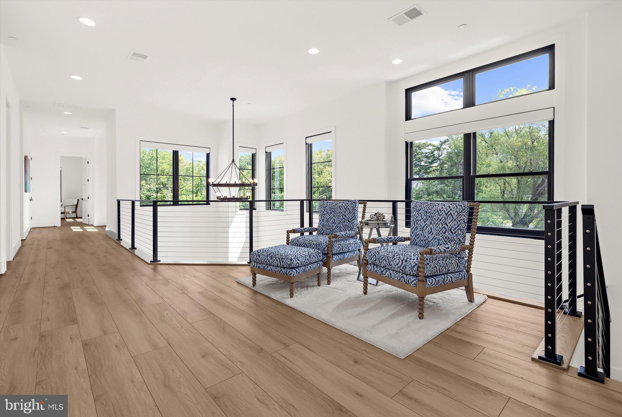 12606 Newgate Road Rockville, MD 20850 - Photo 12 of 43 a living room with furniture and large windows