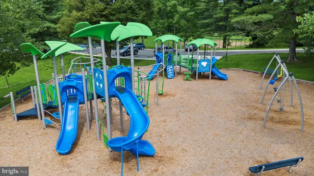 a view of outdoor space with a garden and signage
