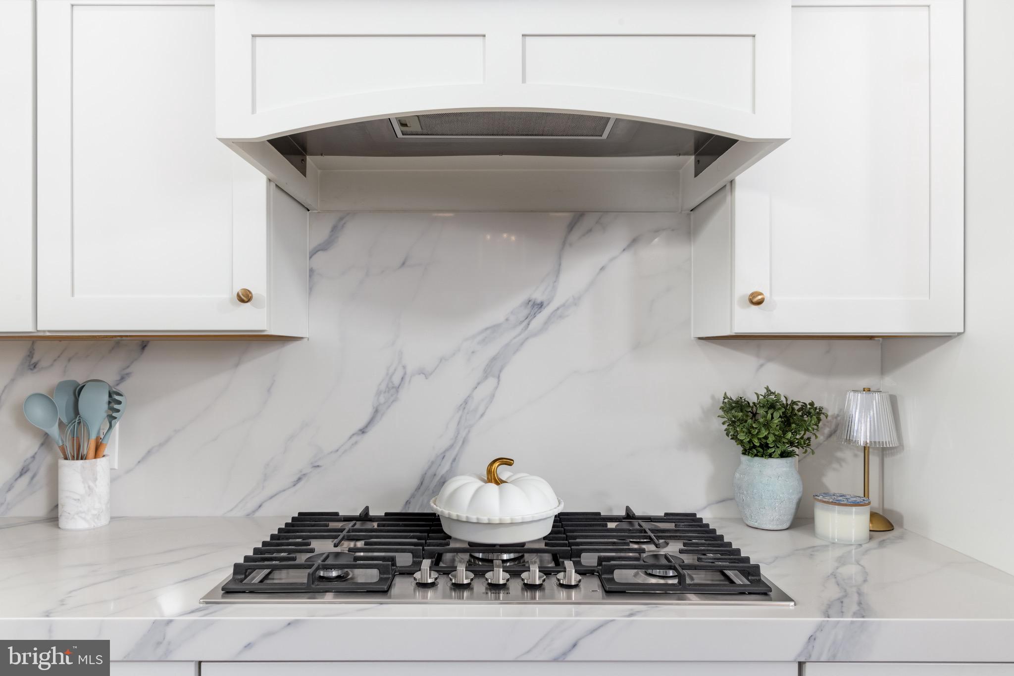 12606 Newgate Road Rockville, MD 20850 - Photo 29 of 43 a kitchen with a stove and cabinets