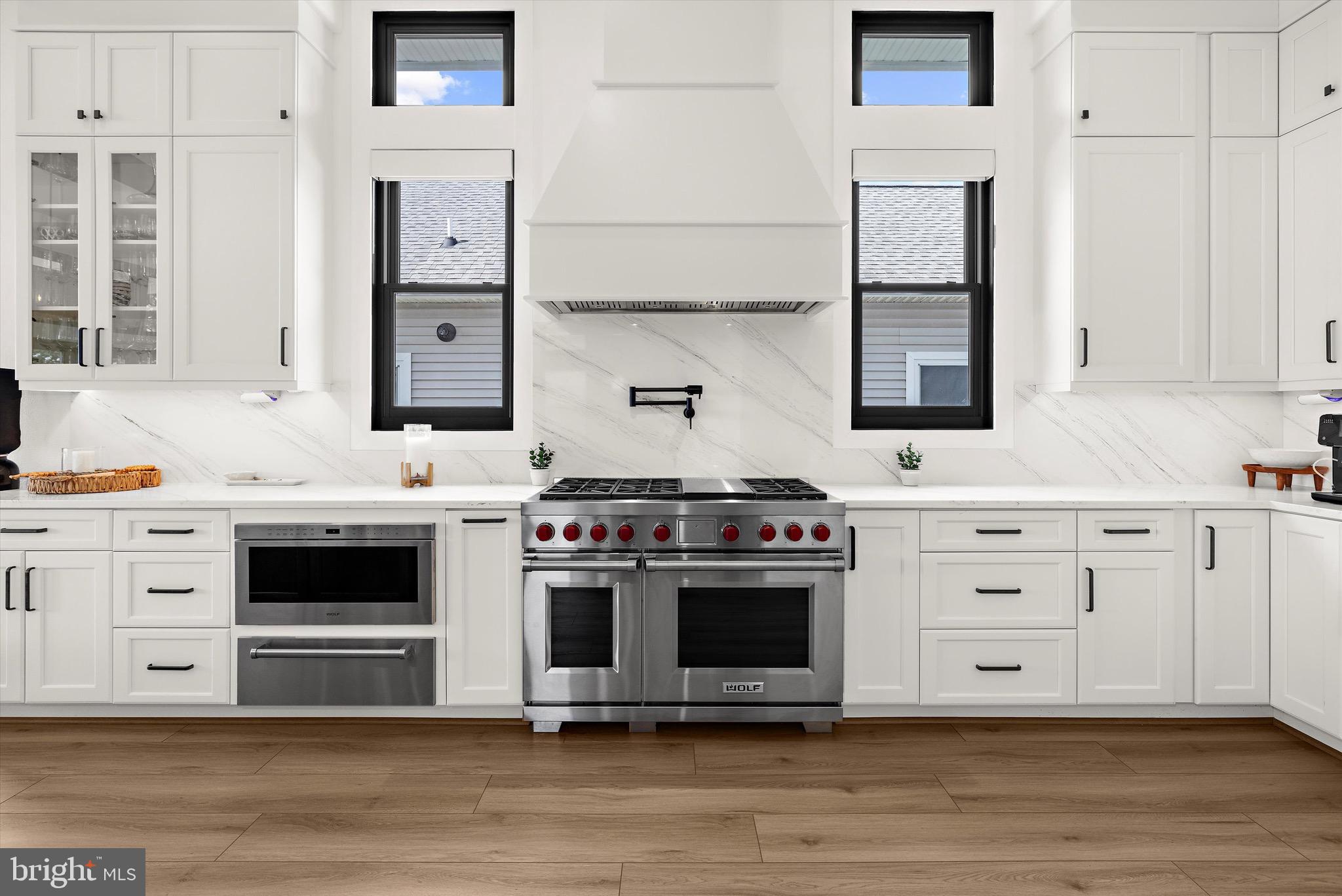 12606 Newgate Road Rockville, MD 20850 - Photo 4 of 43 a kitchen with stainless steel appliances granite countertop a stove and a sink