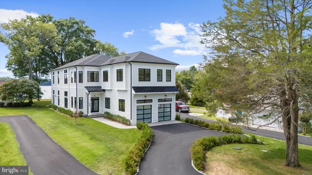 a front view of a house with a yard table and chairs