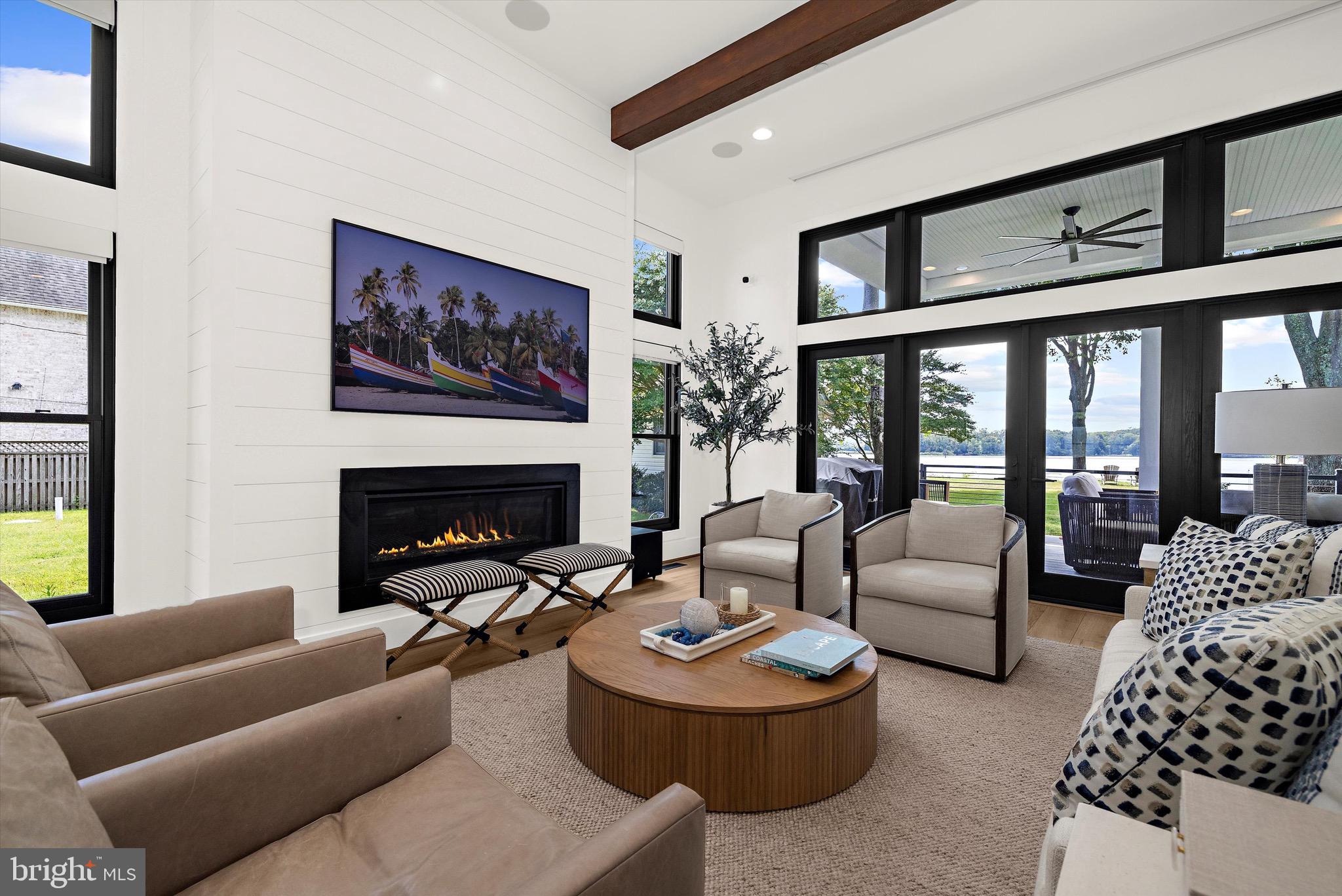 12606 Newgate Road Rockville, MD 20850 - Photo 5 of 43 a living room with furniture and a fireplace