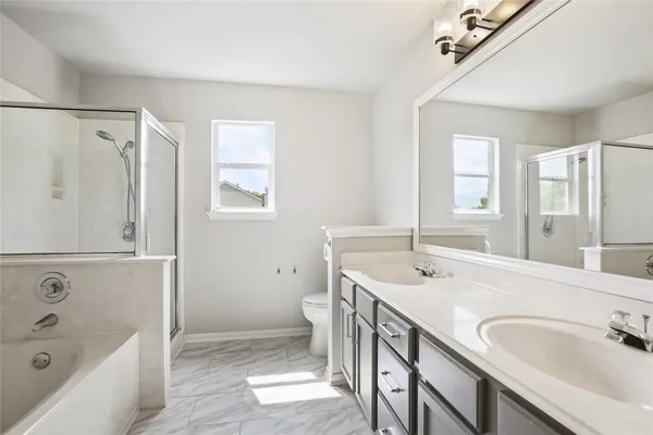 a view of a backyard with floor to ceiling window and wooden fence