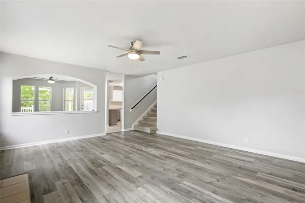 a view of a kitchen with a stove cabinets and wooden floor